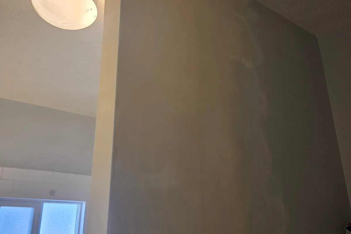 Smooth, level-5 finished drywall wall ready for paint